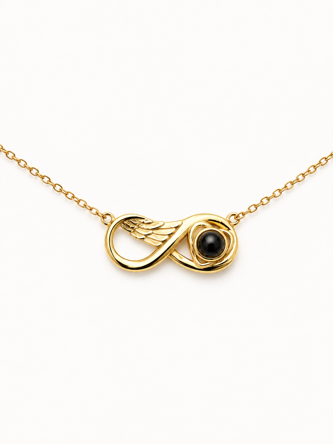 Gold Infinity Pendant with love heart surrounding a projection stone with gold chain on a white background 