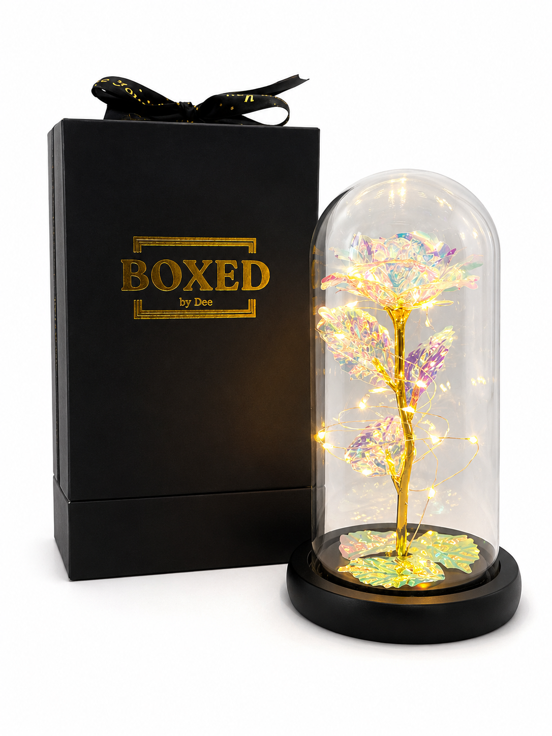 A pearl or white colour metallic rose displayed under an illuminated glass dome and presented beside a beautiful Boxed by Dee gift box with a white background.
