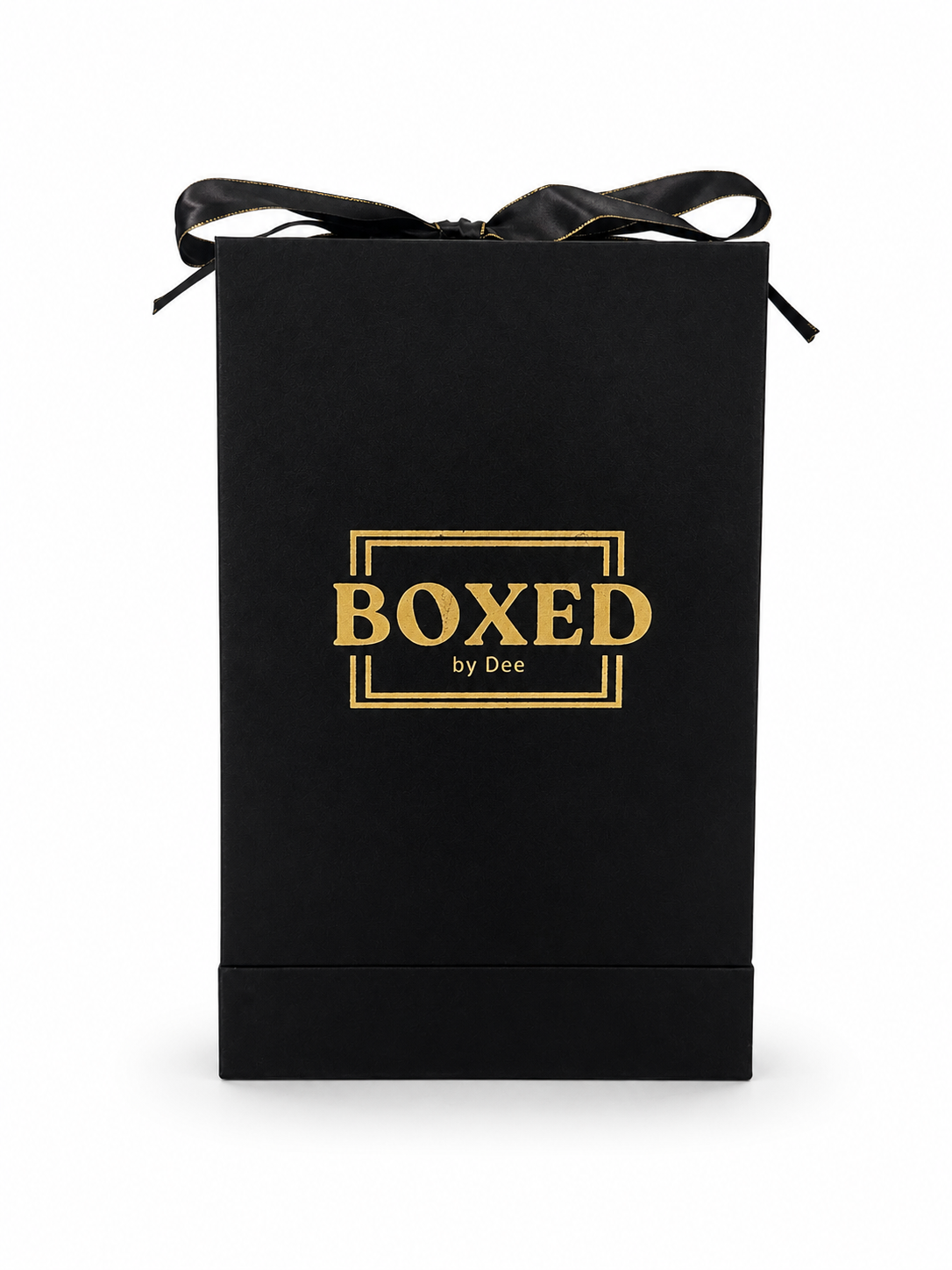 A black gift box with a black ribbon bow on top, featuring the gold foil text 'BOXED by Dee' in the center, set against a plain white background.
